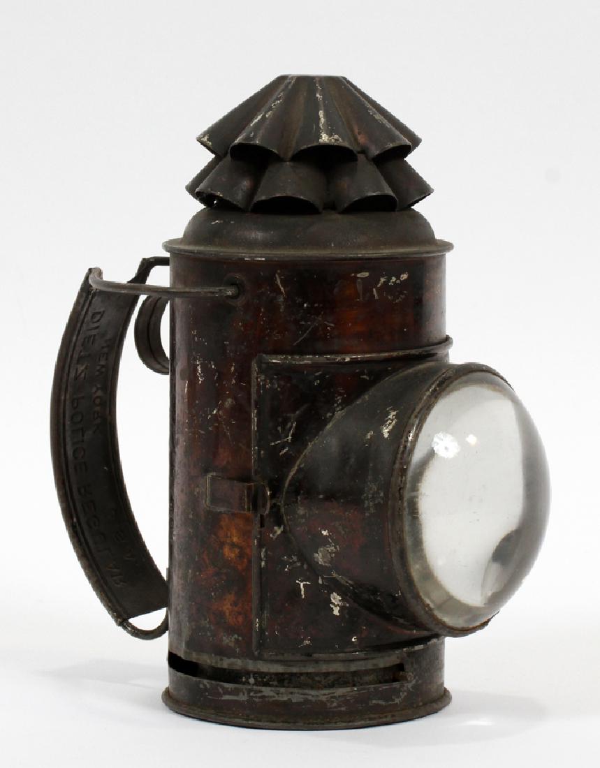 DIETZ, NEW YORK POLICE DEPARTMENT OIL LANTERN: DIETZ, NEW YORK POLICE DEPARTMENT, HANDHELD, PEWTER AND TIN, OIL LANTERN 19TH C ANTIQUE, H 7 1/2", W 4", D 6 1/2" magnified searchlight lens, made of pewter and tin with enamel paint.