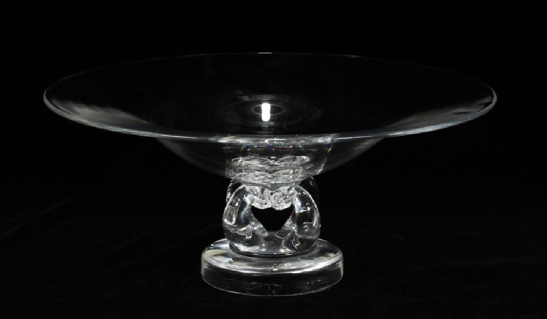 STEUBEN HAND BLOWN ART GLASS COMPOTE: STEUBEN HAND BLOWN ART GLASS COMPOTE H 4.5" DIA 10" Steuben clear art glass compote. Having four curved glass rods attached to a round glass disc base. Signed.