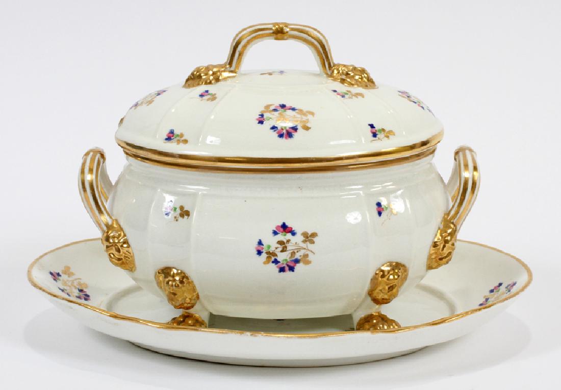 DERBY PORCELAIN COVERED TUREEN AND UNDER PLATE: DERBY PORCELAIN COVERED TUREEN AND UNDER PLATE H 5" DIA 9" Derby porcelain covered tureen and under plate. White porcelain ground painted with pink and blue sprays of flowers. Augmented with fired gol