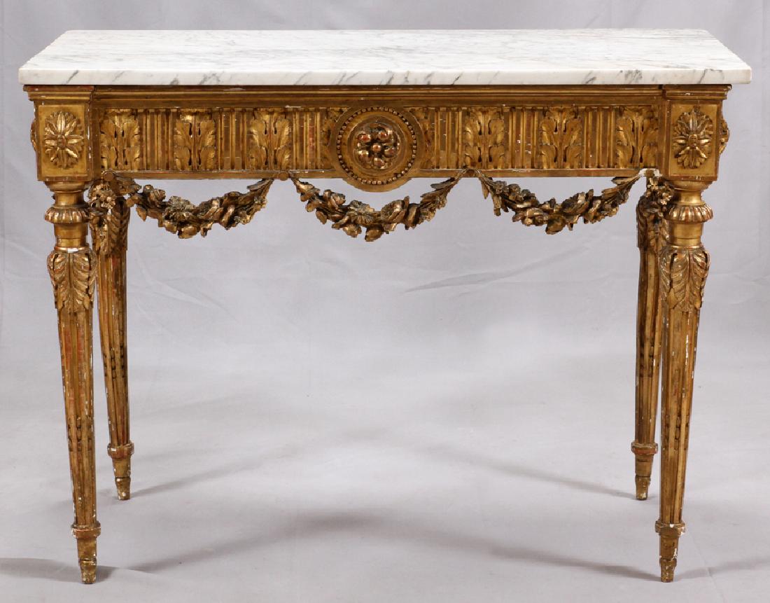 CALACATTA MARBLE TOP SIDEBOARD: CALACATTA MARBLE TOP SIDEBOARD, H 35", W 46", D 22.5"An elegant calacatta marble top atop a gilt wood and gesso sideboard. This piece offers acanthus leaf forms, hanging garland and four fluted, taper