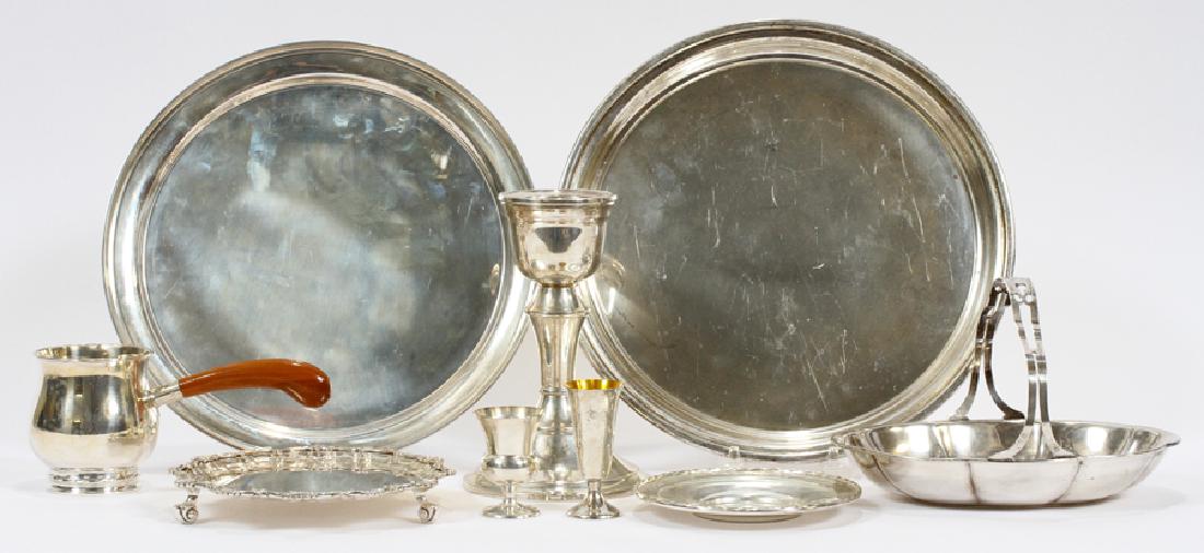 STERLING SILVER COLLECTION, 9 PCS: STERLING SILVER COLLECTION, 9 PCS, H 2.25-6.75", DIA 1.25-10.5", 40.99 OZT A collection of sterling silver table articles. This grouping includes a footed trivet with shell design (DIA 9"), two servin