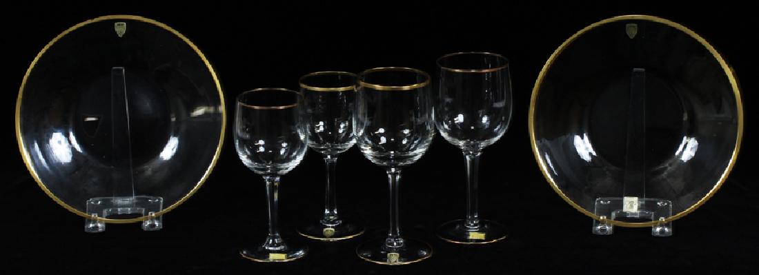 POSCHINGER CRYSTAL WATER GOBLETS, WINES & PLATES: POSCHINGER CRYSTAL WATER GOBLETS, WINES, AND PLATES 44 PCS. The grouping consist of 17 wines height 6 3/4" and 16 wine glasses, height 6". With 14 plates, Dia. 8 1/8" The pieces clear with gold trim .