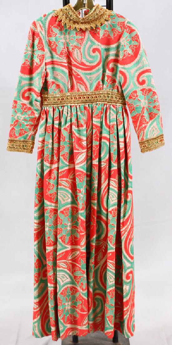VINTAGE OSCAR DE LA RENTA BOUTIQUE BROCADE DRESS: VINTAGE OSCAR DE LA RENTA BOUTIQUE BROCADE DRESS CIRCA 1960'S - 1970'S The dress has an overall floral pattern in colors of red, green, white and gold thread. Having sequin trim at the neck, cuffs, an