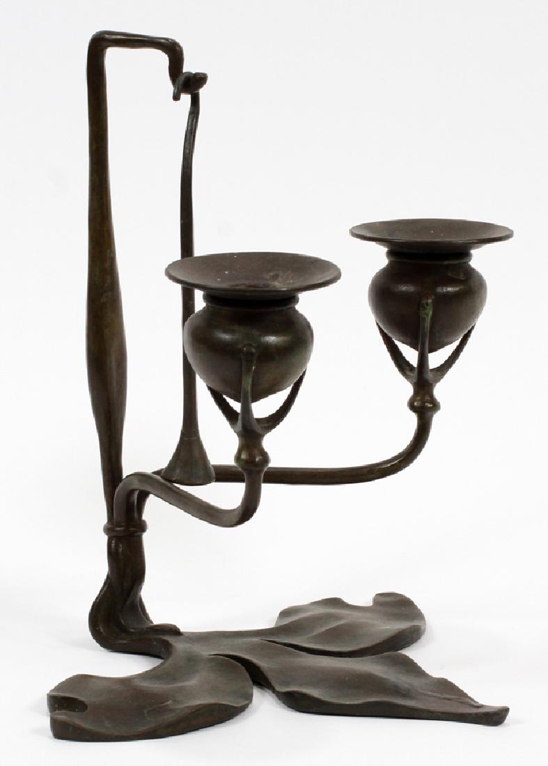 TIFFANY STUDIOS ART NOUVEAU BRONZE CANDELABRUM: TIFFANY STUDIOS, NEW YORK, ART NOUVEAU BRONZE 2 LIGHT CANDELABRUM, H 10 1/8", W 7 1/2" Marked "Tiffany Studios, 12__". Leaf formed base with two lights.