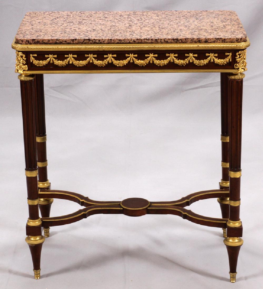 EBENISTE SIGNED LOUIS XVI MARBLE TOP TABLE: L. CHENNIERES JNE, EBENISTE SIGNED, LOUIS XVI MAHOGANY & BRONZE ORMOLU, MARBLE TOP TABLE, H 29", W 15", L 25 1/4" :Bronze floral garland and bow around the apron. Four fluted tapered legs with an hour