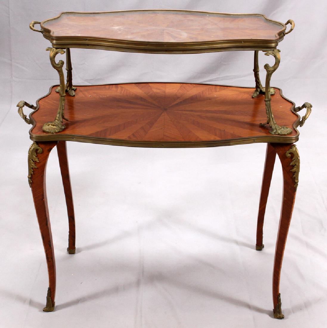 FRENCH, MAHOGANY & BRONZE TRAY TOP TABLE, 19TH C.: FRENCH, MAHOGANY & BRONZE TRAY TOP TABLE, 19TH C., H 34", W 18 1/2", L 34" :Having two tiers with bronze supports, handles and mounts with a scrolling leaf and shell motif. Cabriole legs.