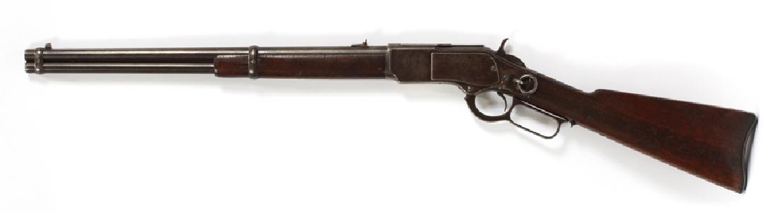 WINCHESTER MODEL 1873 'KINGS IMPROVEMENT' RIFLE: WINCHESTER MODEL 1873, 'KINGS IMPROVEMENT', LEVER ACTION RIFLE, .44-40 CAL, C1881, L 20" BBL, #77290 (1881) :Having a 20" round barrel, walnut stock, and forearm, saddle ring, and 15 round tubular mag