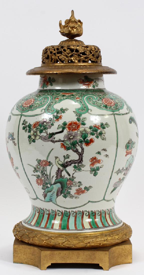 FRENCH BRONZE & CHINESE PORCELAIN GINGER JAR: FRENCH BRONZE & CHINESE PORCELAIN GINGER JAR, 19TH C. H 19", DIA 10" :Bronze mounts including flame finial, with hand painted flower and bird motif. impressed "France".