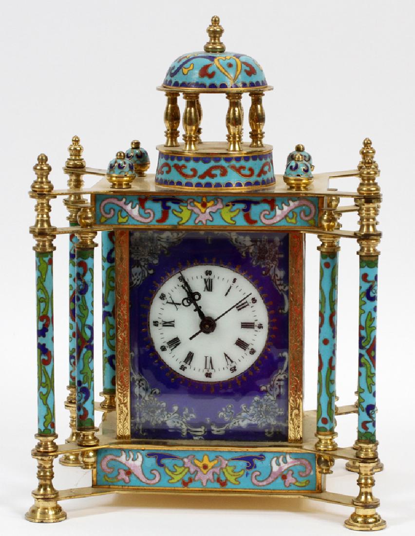 FRENCH STYLE CHAMPLEVE AND BRASS CLOCK, 20TH C.: FRENCH STYLE CHAMPLEVE AND BRASS CLOCK, 20TH C., H 10", L 7", D 5.5" :Having a brass case, domed finial and columns and panels with floral champleve decoration on four feet. Side panels feature female