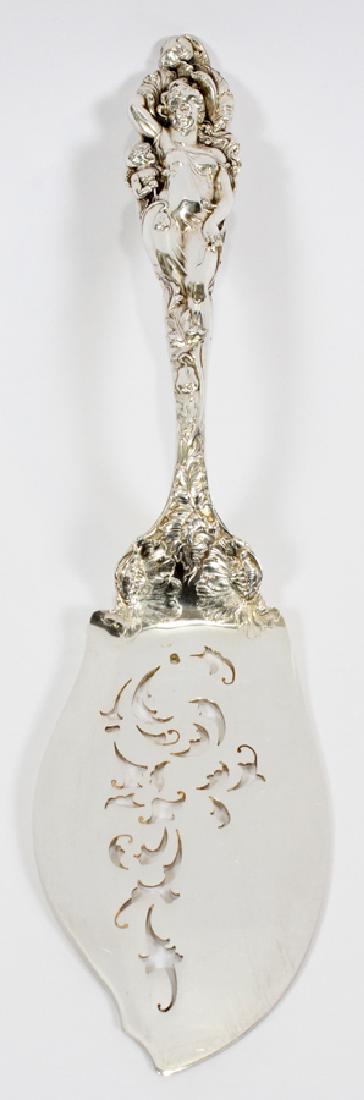 REED AND BARTON STERLING FISH SERVING SLICE: REED AND BARTON STERLING "LOVE DISARMED" FISH SERVING SLICE L 13" :Elaborate design of Art Nouveau lady and poppies. Pierced flat surface. Total weight: 8.06From an important Sandringham Way, Bloomfie