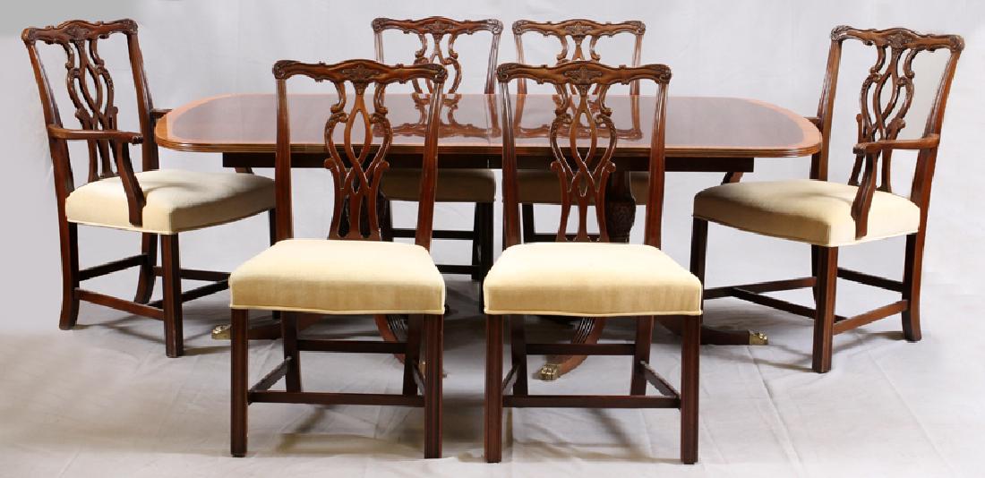 FEDERAL STYLE MAHOGANY DINING TABLE & CHAIRS: FEDERAL STYLE MAHOGANY DINING TABLE & CHIPPENDALE STYLE CHAIRS, SEVEN PIECES :A mahogany two pedestal dining table H 27.5", W 46", L 75" and two boards 20". Accompanied by six carved mahogany Chippend