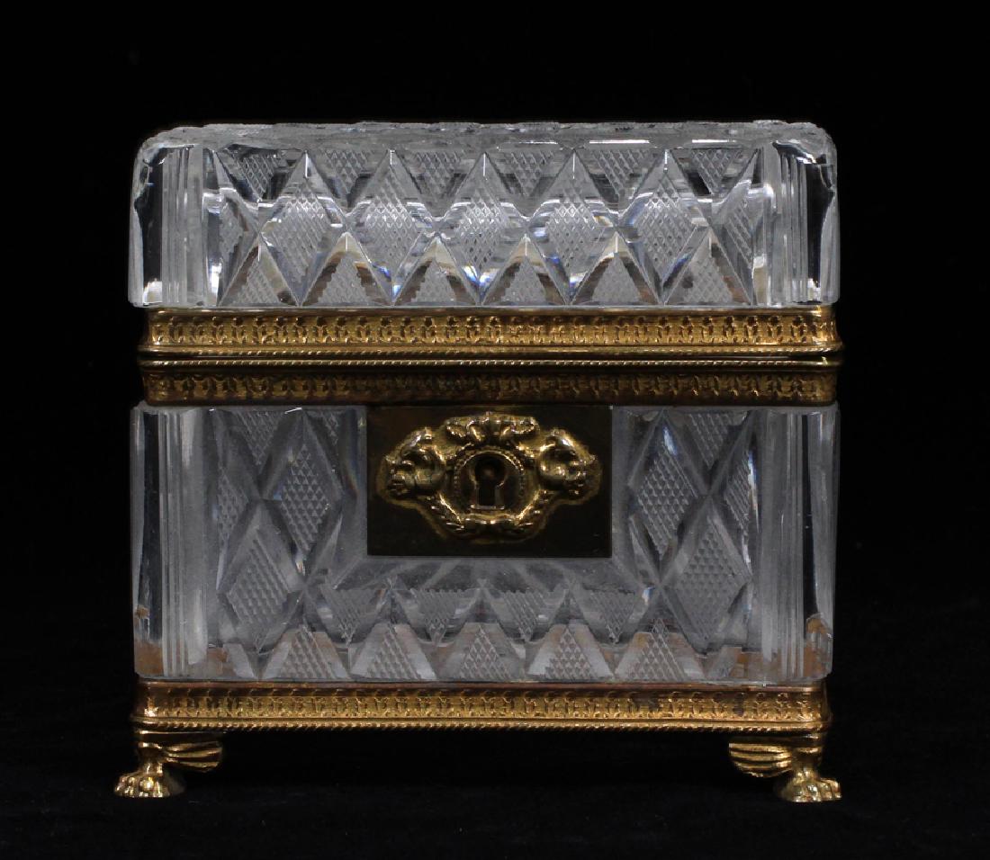 FRENCH CUT GLASS JEWEL CASKET, CA. 1900: FRENCH CUT GLASS JEWEL CASKET, CA. 1900, H 4", W 4 1/4", D 3":A French hand cut glass jewelry casket, circa 1900. This piece features gilded bronze hardware and strawberry diamond cut motif.