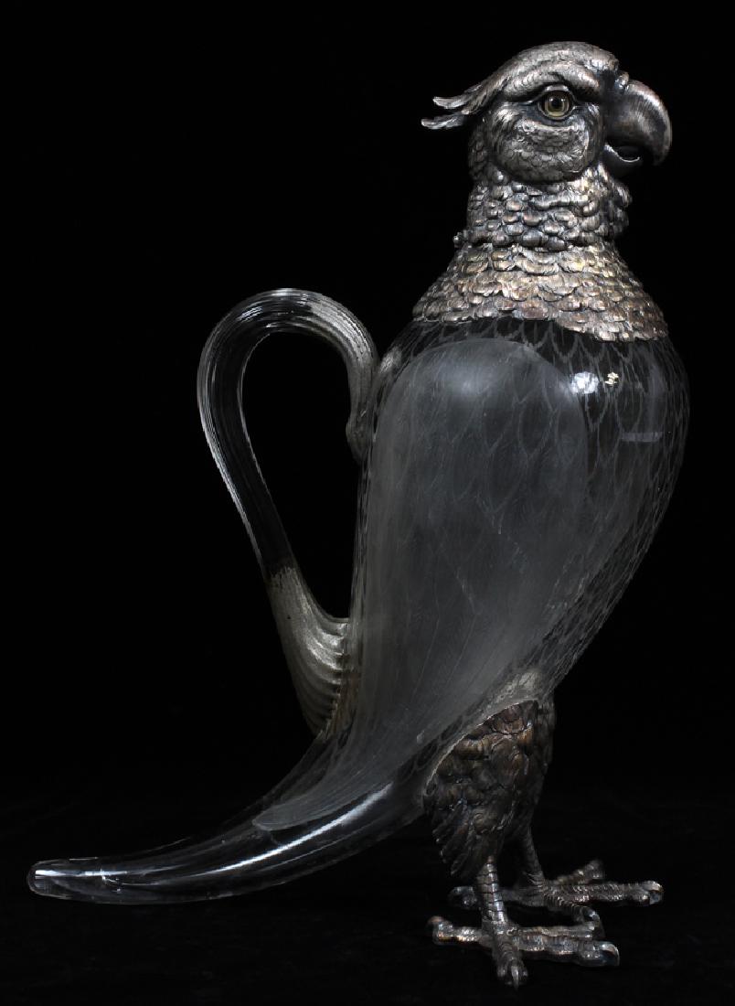 800 SILVER & GLASS WINE CARAFE: 800 SILVER & GLASS WINE CARAFE, H 12.5", W 5", D 9":A parrot form wine carafe. This piece offers an etched glass vessel with 800 pts. silver overlay. Having a hinged top, enamel eyes and a fluted hand