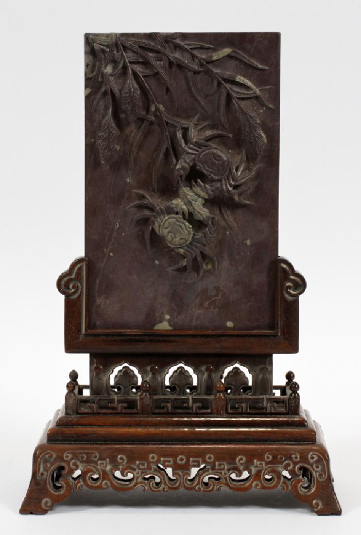 CHINESE, INKSTONE, TABLE SCREEN: CHINESE, INKSTONE, TABLE SCREEN, H 8", W 5" (PLAQUE) :Having an inkstone plaque with crabs and seaweed in relief. Carved gold painted calligraphy on the verso. having a rosewood stand with a turned wo