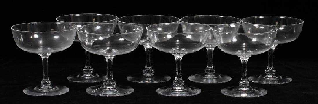 STEUBEN CHAMPAGNE GLASSES, 8 PCS, H 4": STEUBEN CHAMPAGNE GLASSES, 8 PCS, H 4":A selection of eight Steuben champagne glasses. Each having a wide rim and signature "Steuben" engraved to the undersides. With box. Property of Robert Welchli T