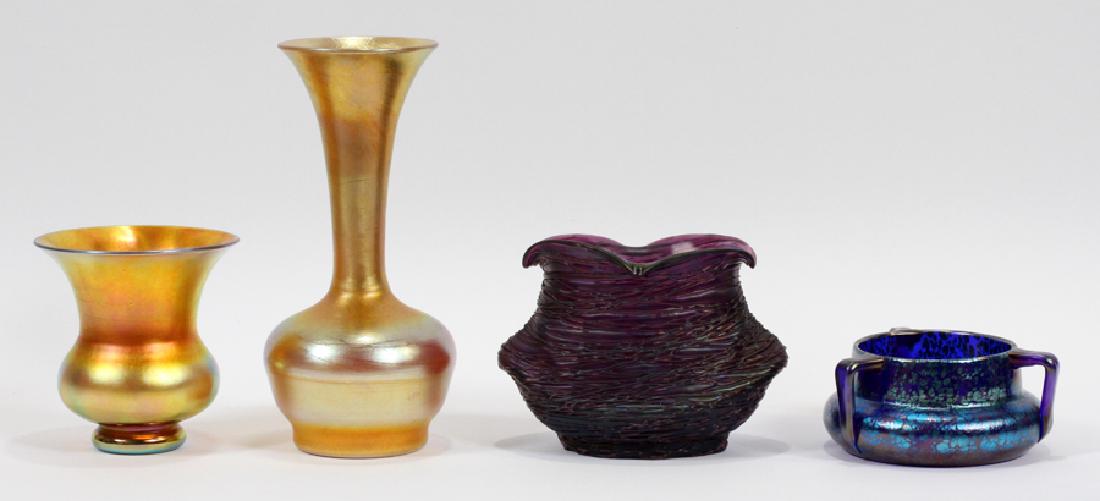 STEUBEN, DURAND, CZECH AND UNSIGNED GLASS VASES: STEUBEN, DURAND, CZECH AND UNSIGNED LOT ART NOUVEAU FAVRILE GLASS VASES, 4, H 10", DIA 7.5" :Lot of Art Nouveau favrile art glass vases in an assortment of colors. Blue three handled vase is signed "C