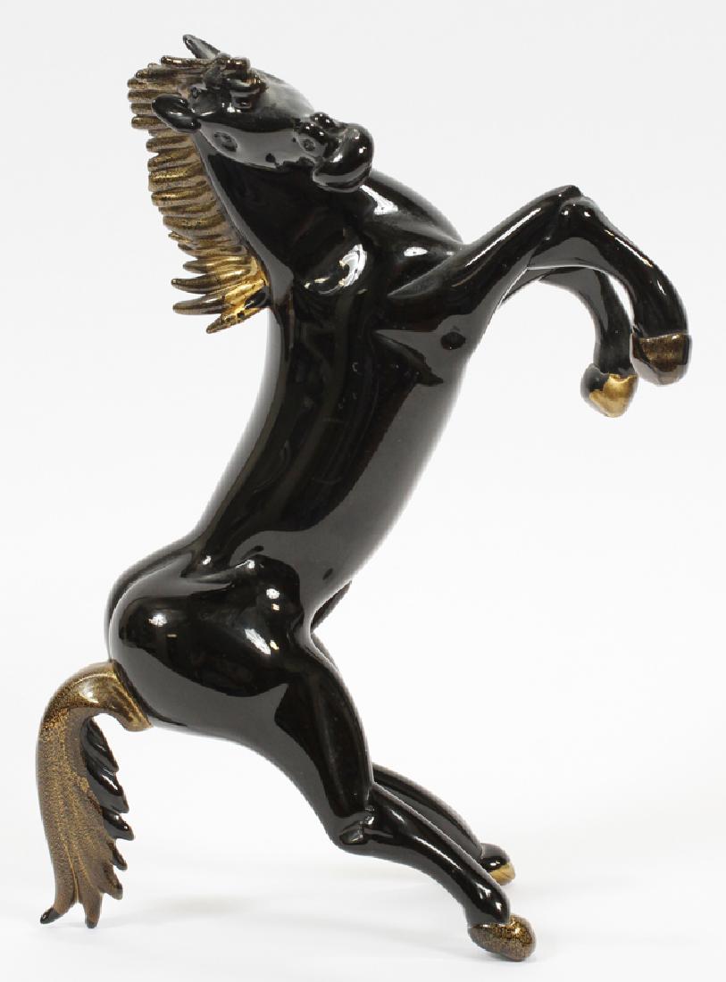 SIGNED MARIO BADIOLI MURANO GLASS HORSE SCULPTURE: SIGNED MARIO BADIOLI (ITALY, B. 1940) MURANO GLASS HORSE SCULPTURE, H 8", W 13" :A signed black glass horse sculpture by renowned Murano glass maestro Mario Badioli. Gold flecks in tail and hoofs.