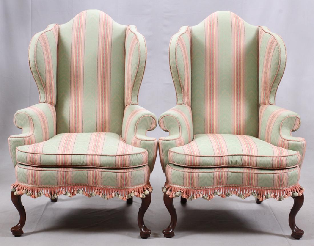 KITTINGER UPHOLSTERED WINGBACK CHAIRS, PAIR: KITTINGER UPHOLSTERED WINGBACK CHAIRS, PAIR, H 49", W 33", D 29":A pair of upholstered Kittinger wingback chairs. Offering cabriole legs and a tassel skirt.