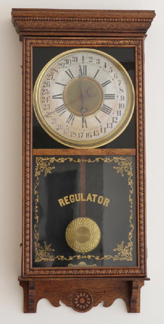 SESSIONS CLOCK CO. OAK REGULATOR WALL CLOCK: SESSIONS CLOCK CO. OAK REGULATOR WALL CALENDAR CLOCK, H 38", W 19" :Gilt "Regulator" on glass lower panel. Sessions Co. of Forestville, Conn. From an elegant home on Shady Creek Lane, Farmington Hills