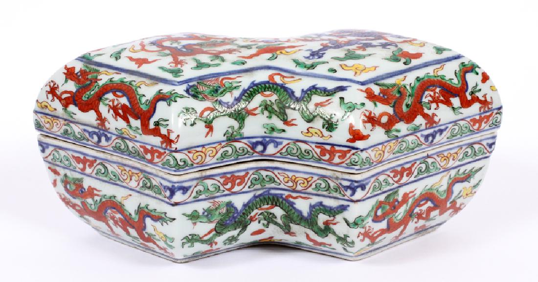DRAGON MOTIF PORCELAIN BOX H 5" W 6" L 11": DRAGON MOTIF PORCELAIN BOX H 5" W 6" L 11" :A double diamond shaped Chinese porcelain box with a multi colored dragon motif. Having a loose lid.