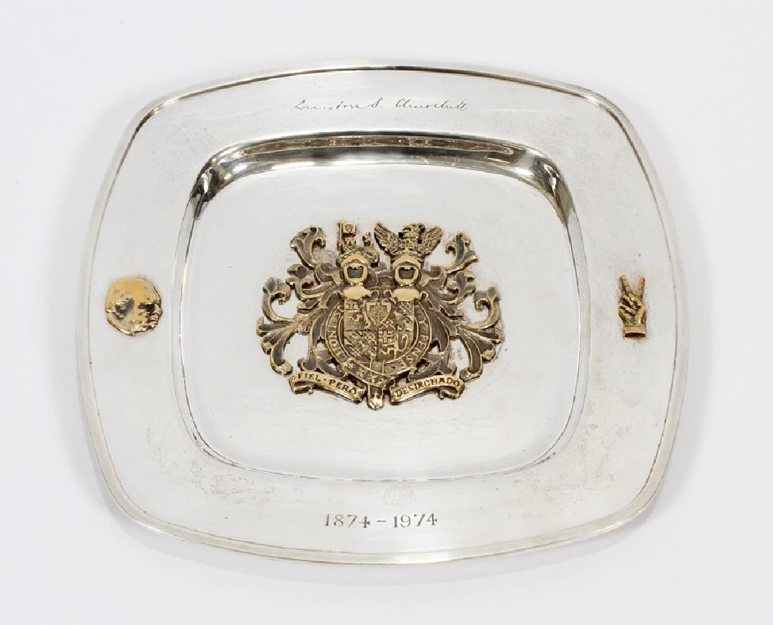 LONDON, STERLING SILVER WINSTON CHURCHILL CHARGER: LONDON, STERLING SILVER WINSTON CHURCHILL COMMEMORATIVE CHARGER W 9" L 9" :A sterling silver charger commemorating the life of Winston Churchill. Engraved with Churchill's signature at the top, the da