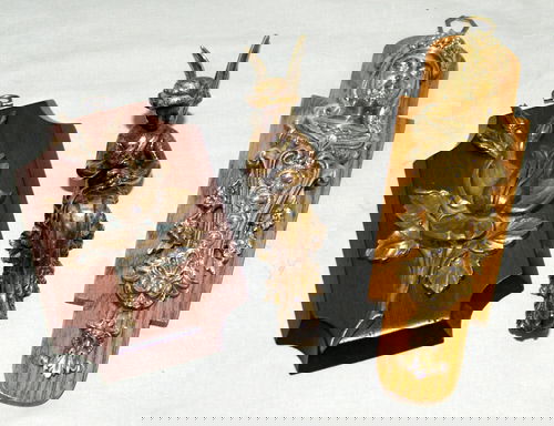 FRENCH BRONZE FURNITURE MOUNTS, THREE, H 7"-9": FRENCH BRONZE FURNITURE MOUNTS, THREE, H 7"-9" Including 1 with a king's mask, H.9", 1 flower, H.7", and 1 winged female, H.8". Ex estate Robert Burrows