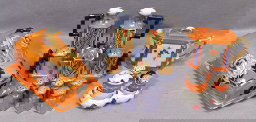 JAPANESE ART DECO PORCELAIN TABLE ACCESSORIES, C.: JAPANESE ART DECO PORCELAIN TABLE ACCESSORIES, C. 1920, TEN including a three piece condiment set, six salt and pepper shakers, a seven piece caster set, a tea pot and a cheese dome.