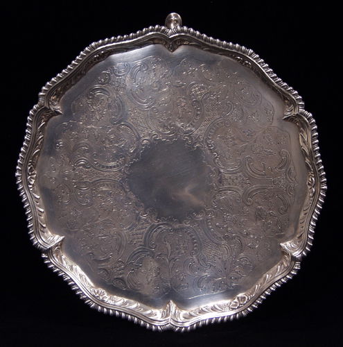 ENGLISH GEORGE III STERLING SILVER SALVER, JOHN Q: ENGLISH GEORGE III STERLING SILVER SALVER, JOHN QUANTOCK, LONDON, 1768-69, DIA 12" Gadrooned rim, raised on three hoof feet, hallmarks include a crowned leopard, lion passant, date letter n, and maker