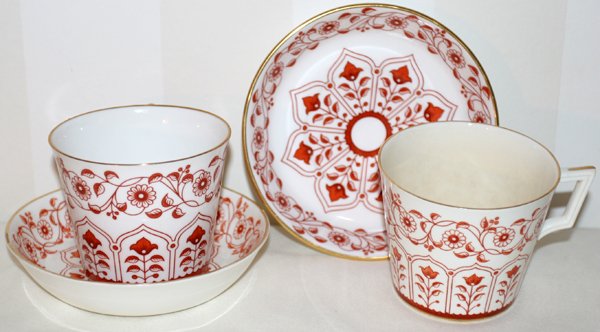 ROYAL CROWN DERBY TEA CUPS & SAUCERS + BOWL: ROYAL CROWN DERBY PORCELAIN TEA CUPS & SAUCERS, NINE SETS, WITH CREAMER & SUGAR BOWL:With a brown floral pattern. Plus creamer and sugar. Old pattern with tulip motif. Removed from Colonial Road, Gros