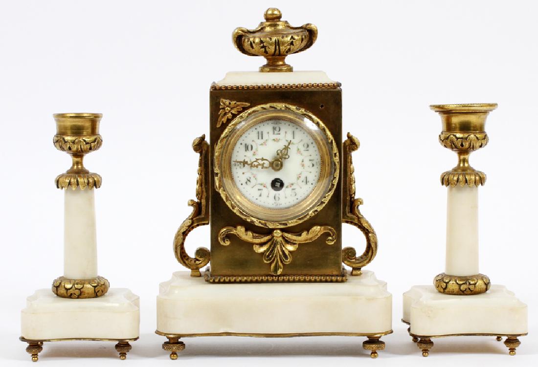 FRENCH BRONZE & MARBLE CLOCK GARNITURE, C. 1880,: FRENCH BRONZE & MARBLE CLOCK GARNITURE, C. 1880, SET OF THREE PIECES, H 8" (CLOCK), W 5 1/2":Enamel dial, Arabic numerals, swags with pink roses. Including 1 mantel clock, H.8", and 2 single-light can