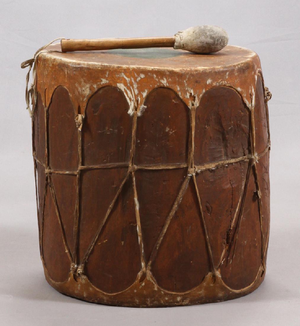 NORTH AMERICAN INDIAN DRUM, H 16", W 13 1/4": NORTH AMERICAN INDIAN DRUM, H 16", W 13 1/4" :Tan, white and green. Includes drumstick.