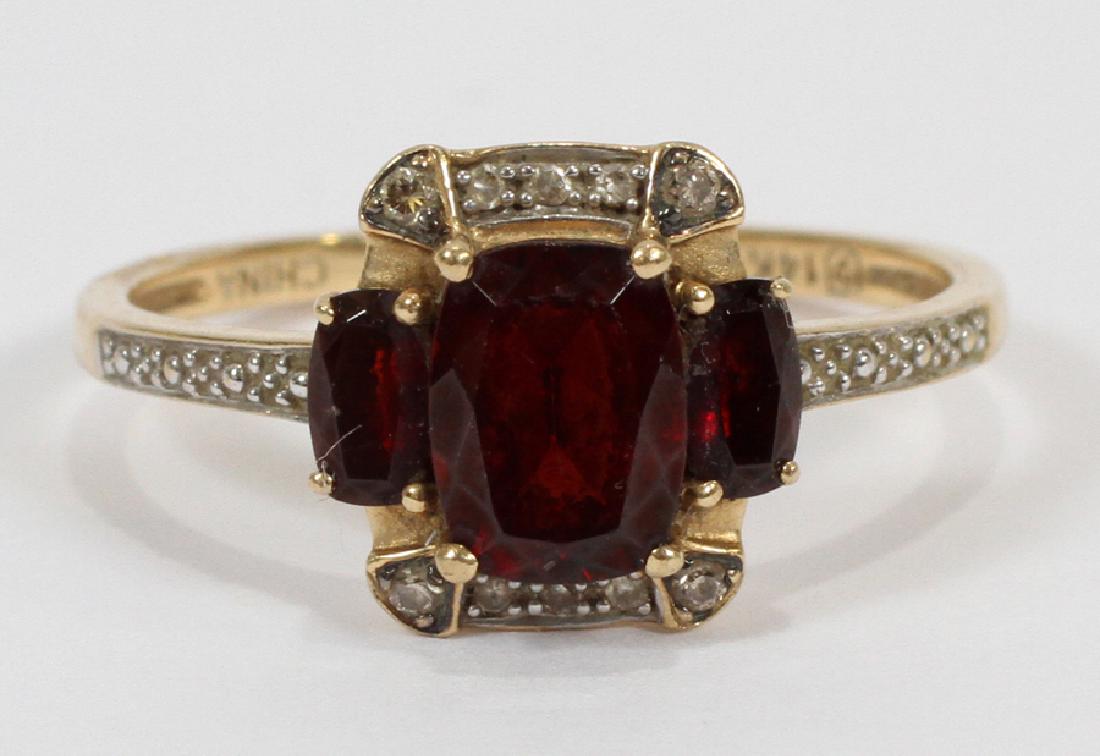 14KT GOLD & GARNET OVAL CUT RING: 14KT GOLD & GARNET OVAL CUT RING, SIZE: 10, T.W. 3 GR :An oval cut garnet ring in a 14kt yellow gold setting. China. Ring size: 10. Total weight: 3 grams.
