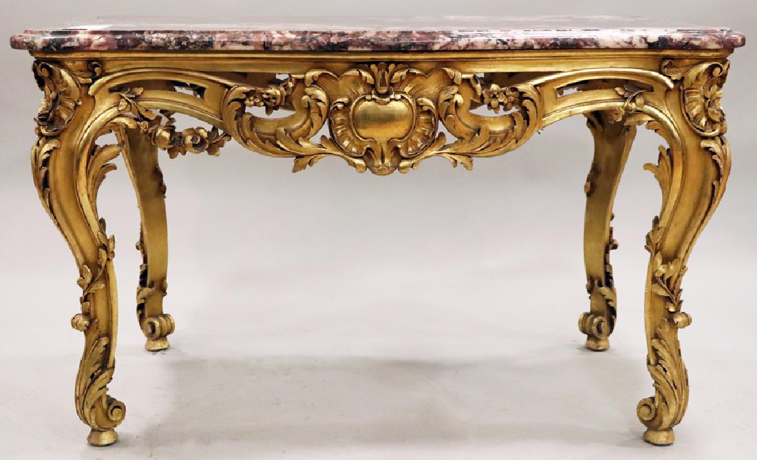 LOUIS XV STYLE CARVED WOOD, MARBLE TOP TABLE: LOUIS XV STYLE, CARVED WOOD WITH GOLD LEAF, MARBLE TOP PARLOR TABLE, H 31 1/4", L 51", D 30 1/2" :Gold leaf accents, bevelled rouge marble top. Rococo scroll legs with pad feet.