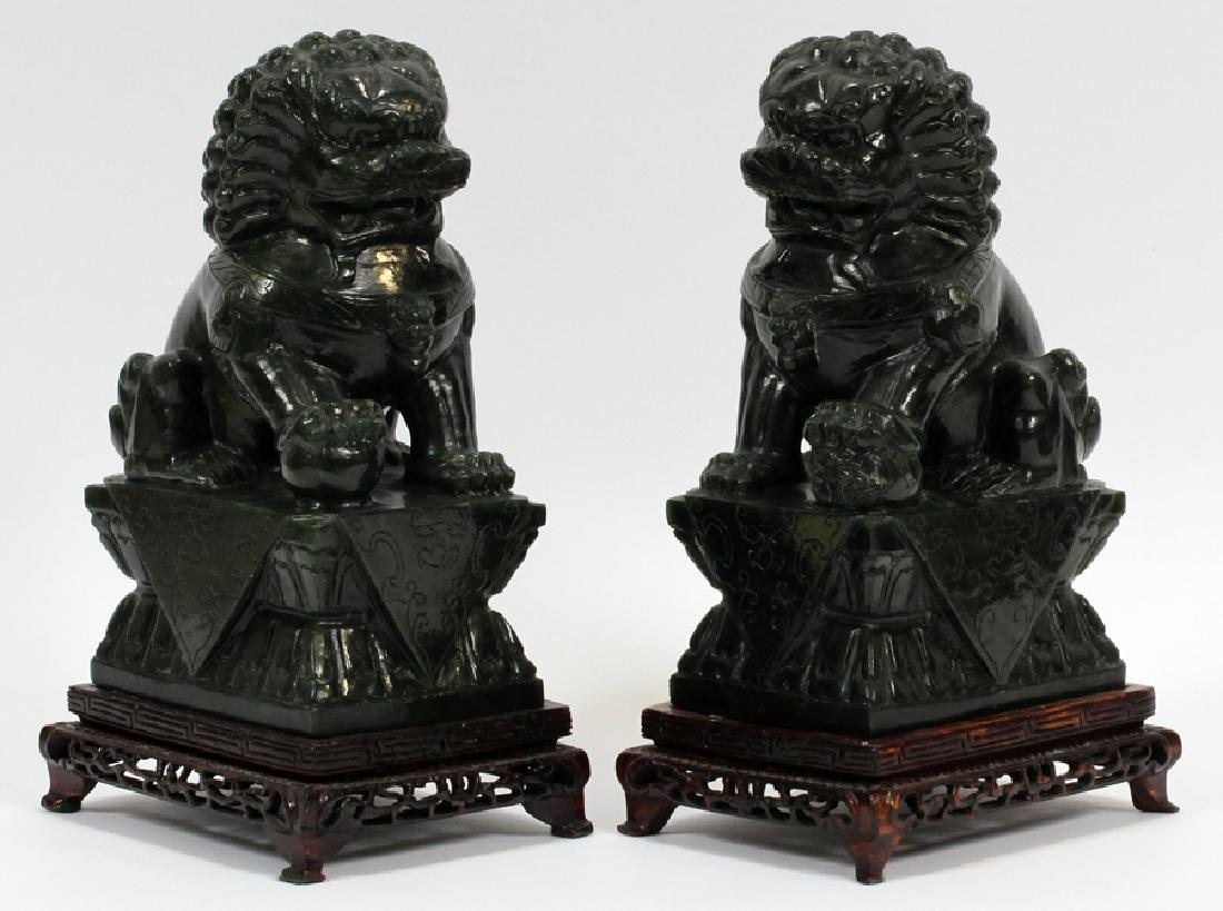 PAIR ANTIQUE CHINESE DARK GREEN JADE FOO DOGS 2: PAIR ANTIQUE CHINESE DARK GREEN JADE FOO DOGS 2 H 9" W 4" D 5.25" :Pair of dark green jade antique Chinese foo dogs. Carved in full relief, with expressive features. Jade measures approximately 9" tal
