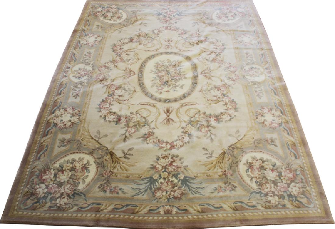 CHINESE AUBUSSON STYLE WOOL RUG: CHINESE AUBUSSON STYLE WOOL RUG, W 8' 6", L 11' 4" :A Chinese Aubusson style wood rug having a beige ground with a large floral border, an oval central medallion and corner medallions with an overall 