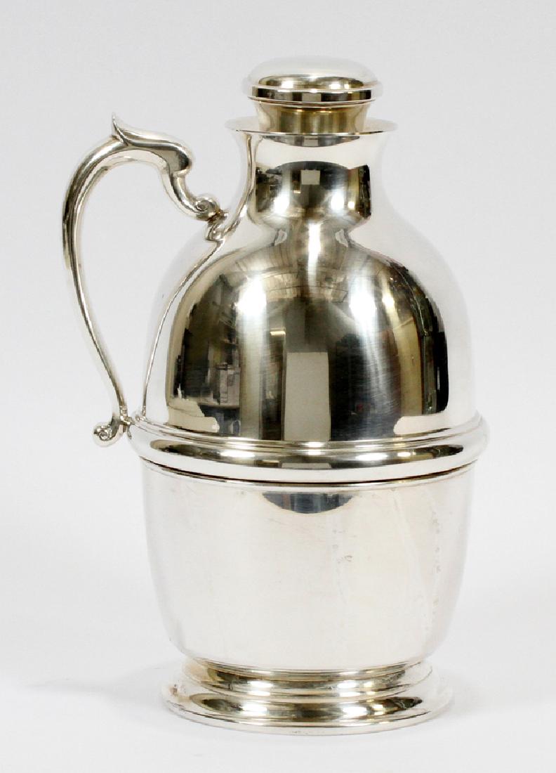 STERLING THERMOS, BY TUTTLE SILVERSMITHS H 11": STERLING THERMOS, BY TUTTLE SILVERSMITHS H 11" :2 1/4 pints. Glass lined. In 1958 the Tuttle Silver Company of Boston was purchased by Wallace Silversmiths. Trade mark is a pine tree over a crescent w