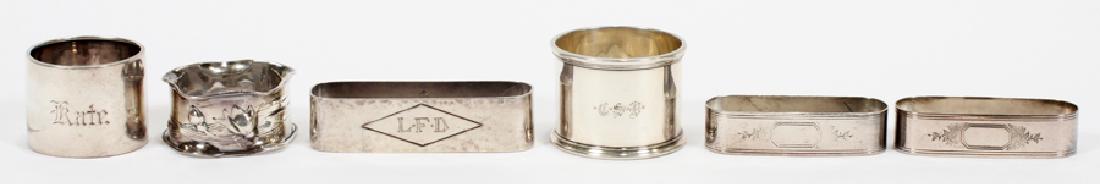 STERLING NAPKIN RINGS, 6: STERLING NAPKIN RINGS, 6 :Four napkin rings are engraved with either initials or names. One napkin ring has the makers mark from the Chicago silver co. Three rings are marked sterling. Two rings are n