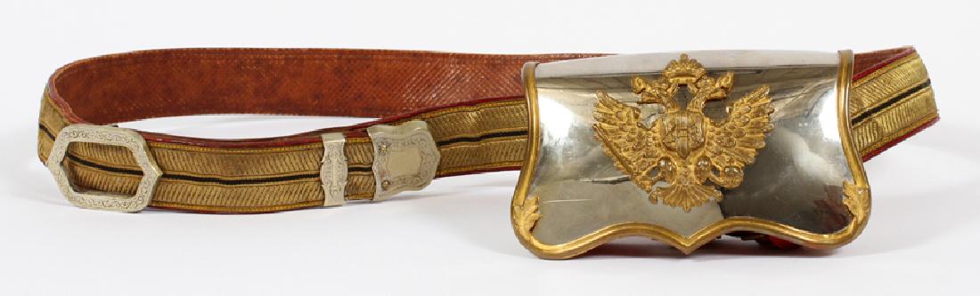 AUSTRIAN, SILVER OFFICER'S BINOCULARS CASE: AUSTRIAN, SILVER OFFICER'S BINOCULARS CASE, CA. 1935, H 3.5", DIA 14.5":A silver and red leather Austrian officer's binocular's case, circa 1935. The case features a brass Austrian coat of arms from t