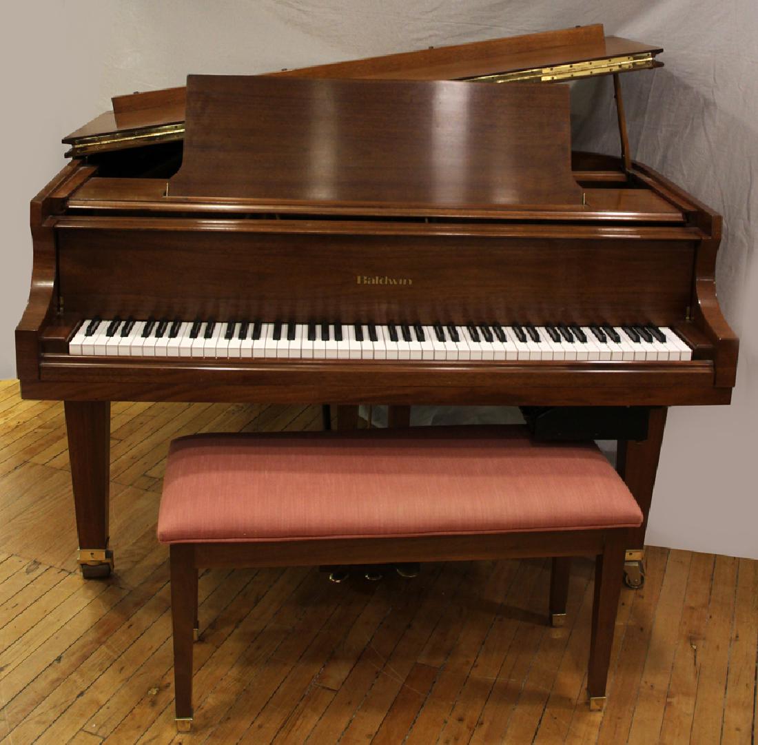 BALDWIN BABY GRAND MAHOGANY PIANO: BALDWIN BABY GRAND MAHOGANY PIANO H 39" W 56" D 67" :A Baldwin mahogany baby grand piano and piano bench. This piano has an aftermarket recorder installed by Evola music. The bench is upholstered in p