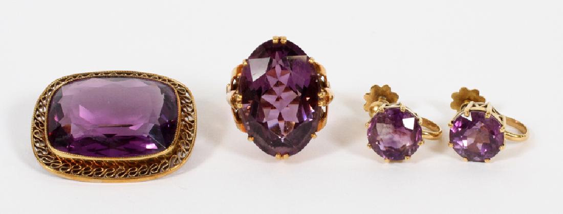 LADY'S AMETHYST & 14KT GOLD RING, EARRINGS & PIN: LADY'S AMETHYST & 14KT GOLD RING, EARRINGS & PIN, 4 PCS H 1", W 1.25" (PIN), T.W. 25 GR:A lady's oval cut amethyst ring, amethyst screw-back earrings and amethyst pin with a 14kt gold filigree setting