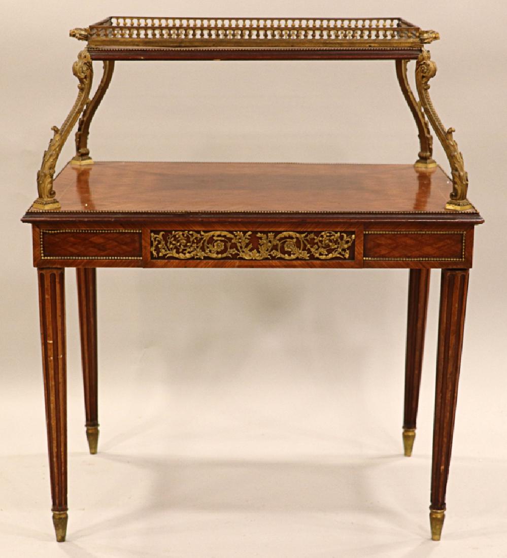 KINGWOOD & TULIP WOOD LOUIS XVI TEA TABLE: KINGWOOD & TULIP WOOD LOUIS XVI TWO-TIERED TEA TABLE H 35", W 29", D 20" :Having reeded legs with a bronze ormolu frieze of vines. Having a top tier with a bronze gallery.