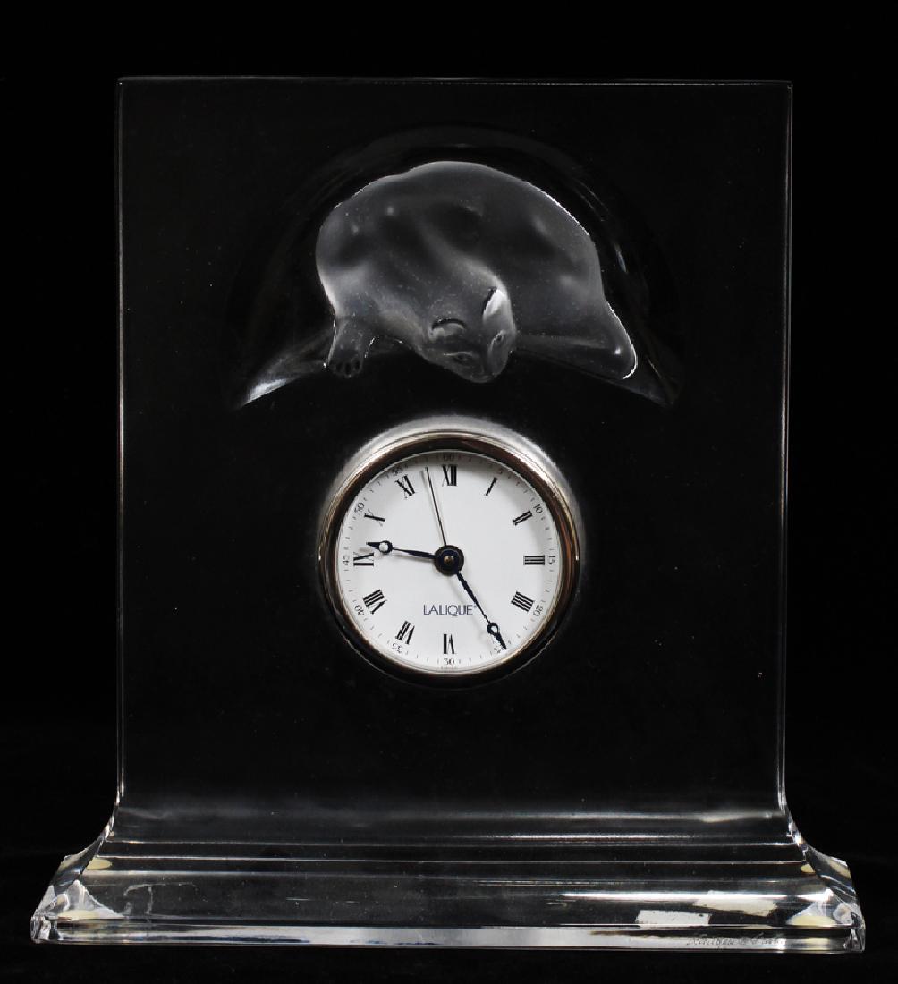 LALIQUE CRYSTAL MANTEL CLOCK H 7.75" W 7" D 2.25": LALIQUE CRYSTAL MANTEL CLOCK H 7.75" W 7" D 2.25" :Having a cat in a half moon above the clock face. Acid etched "Lalique" on bottom right front corner. Measuring approximately 7.75" tall with a width