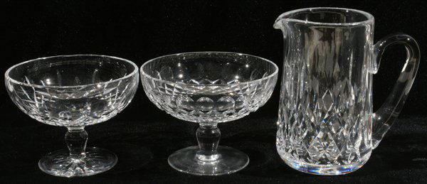 WATERFORD CRYSTAL PITCHER & CANDY DISHES: WATERFORD CRYSTAL PITCHER & PAIR OF FOOTED CANDY DISHES, H 4 1/2"-7":Including 1 pitcher (H 7", W 6 1/2") and 1 pair of 'Lismore' pattern footed candy dishes (H 4 1/2", Dia 6"). Three pieces total. Fr