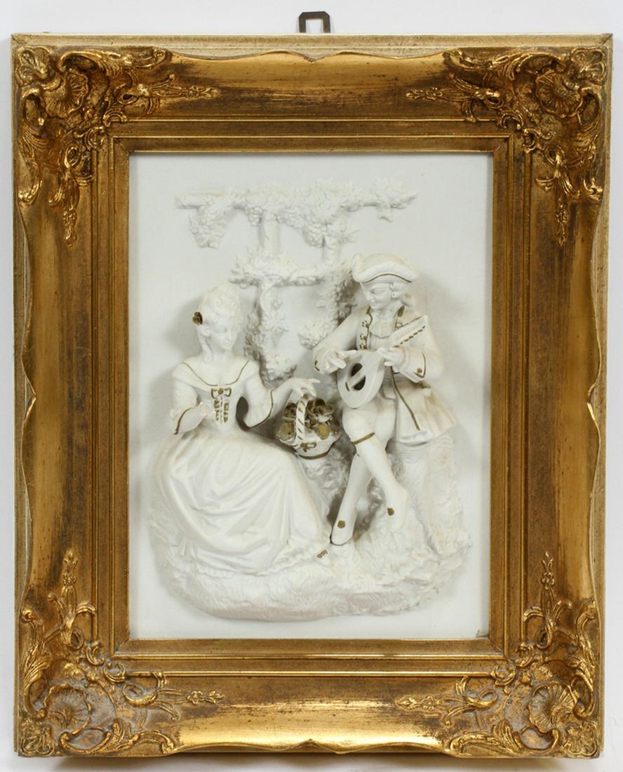 EUROPEAN, FRAMED BISQUE PICTURE, H 9" W 7" IMAGE: EUROPEAN, FRAMED BISQUE PICTURE, H 9" W 7" IMAGE :Depicts a seated courting couple with the man playing the lute, and the woman with a basket of flowers. In high relief. Giltwood frame.