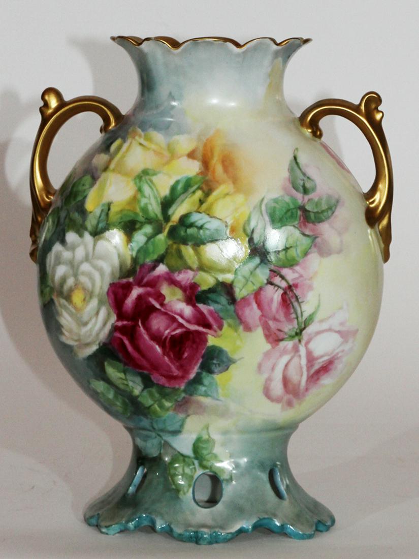 J.P. LIMOGES, HAND-PAINTED PORCELAIN VASE, C. 1902: J.P. LIMOGES, HAND-PAINTED PORCELAIN VASE, C. 1902, H 12", W 9", D 4.5":A signed hand-painted J.P. Limoges porcelain vase. This piece features scroll form handles, gilt accents and rose botanical moti