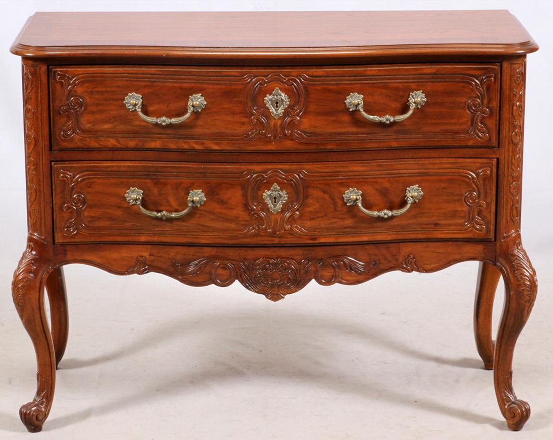 HERITAGE FRENCH REGENCE CARVED WALNUT COMMODE: HERITAGE FRENCH REGENCE CARVED WALNUT COMMODE, H 33'', W 43'', D 17'' :Two drawer commode by Heritage. Carved cabriole legs with scrolling leaf ornament. Drawers have drop hands with lock mechanisms. 