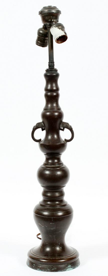 CHINESE BRONZE TABLE LAMP, CIRCA 1900, H 23": CHINESE BRONZE TABLE LAMP, CIRCA 1900, H 23":Shaft cast in sections. Elephant head handles. Base is 19"