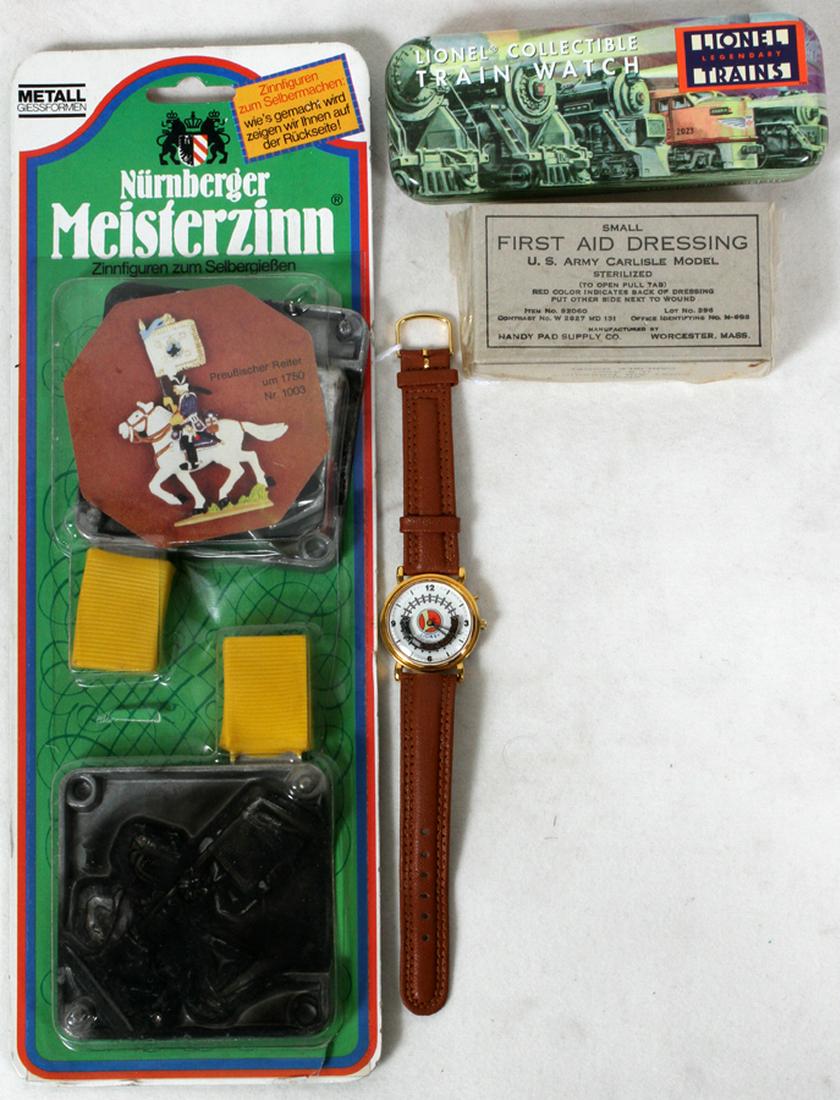 LIONEL TRAIN WRIST WATCH W./ORIGINAL TIN BOX & OTHER: LIONEL TRAIN WRIST WATCH W./ORIGINAL TIN BOX,#2023, & 1ST AID WOUND-DRESSING ORIG UNOPENED BOX WWII OR KOREAN WAR,ETC :4