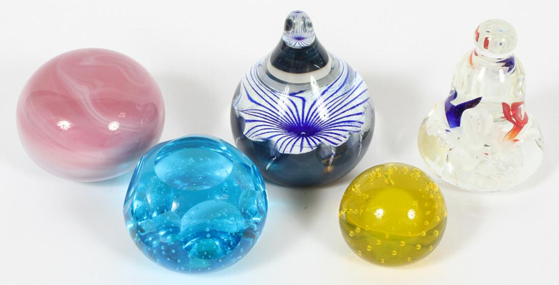 ART GLASS PAPERWEIGHTS, 5 PCS.: ART GLASS PAPERWEIGHTS, 5 PCS., H 1 3/4"-4", DIA 2 1/8" - 3 1/4":Including: one bell shape paper weight having "PCA 1999" pressed to underside, one blue paperweight with air bubbles, one alabaster to 