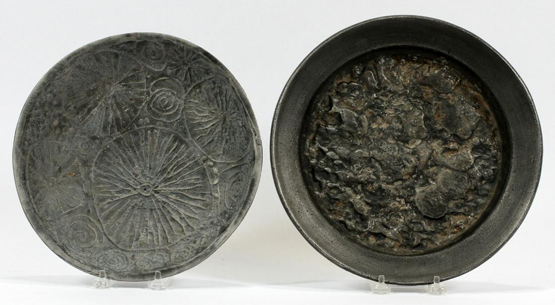 CAST ALUMINUM PLATES, 2 PCS, DIA 10"-11": CAST ALUMINUM PLATES, 2 PCS, DIA 10"-11":Two cast aluminum plates. The larger having "Burke, 8" to the underside. Ex-collection of Josephine Clay Ford.